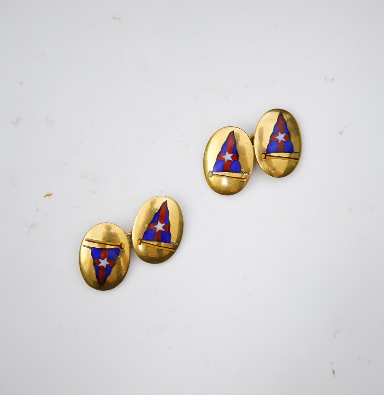 A pair of 9ct gold and enamel cufflinks, circa 1966